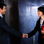 Woman greeting man by elevator
